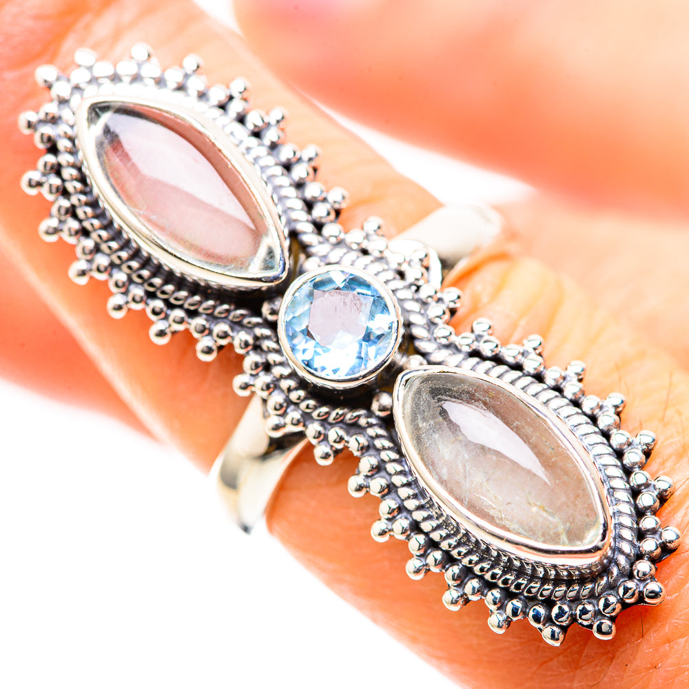 Sterling silver ring with two oval moonstones and oval blue topaz in bezel; close view