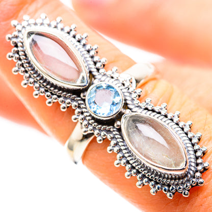 Sterling silver ring with two oval moonstones and oval blue topaz in bezel; close view