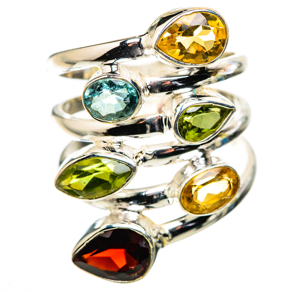 Silver statement ring with oval yellow, green, blue, and red gemstones in prongs