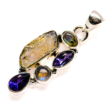 Sterling silver gemstone pendant with oval textured stone, purple marquise, and iridescent cabochons