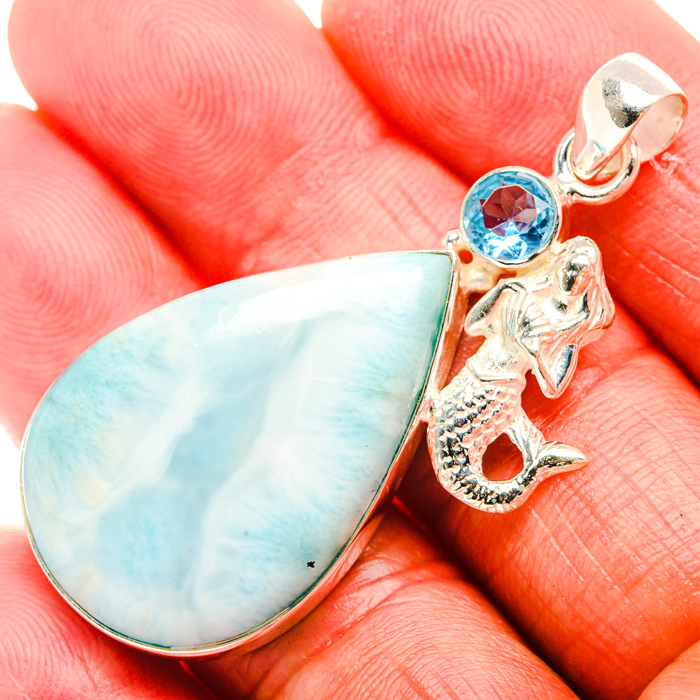 Sterling silver larimar teardrop pendant with blue topaz and sea-creature charm