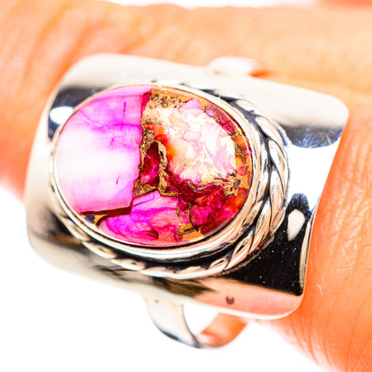 Pink oval gemstone ring with gold flecks on polished 925 sterling silver band