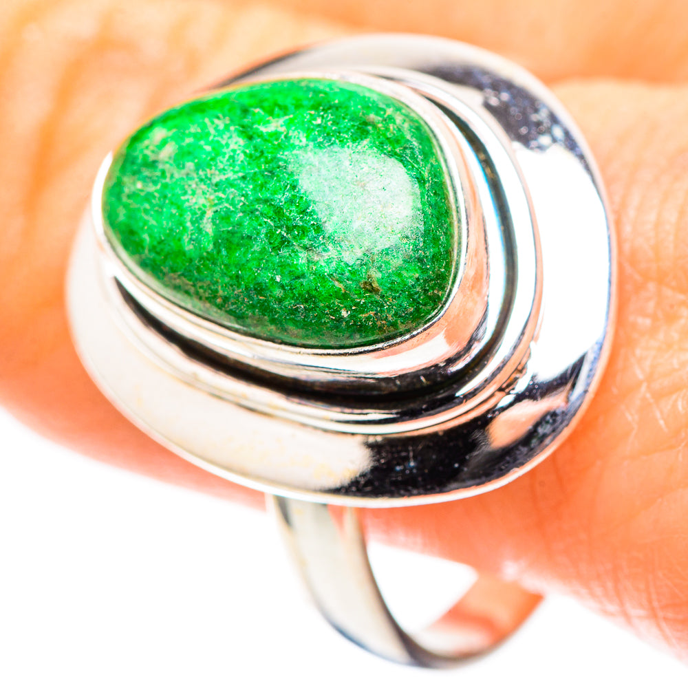 Sterling silver ring with oval green cabochon, layered bezel, high-polish band.